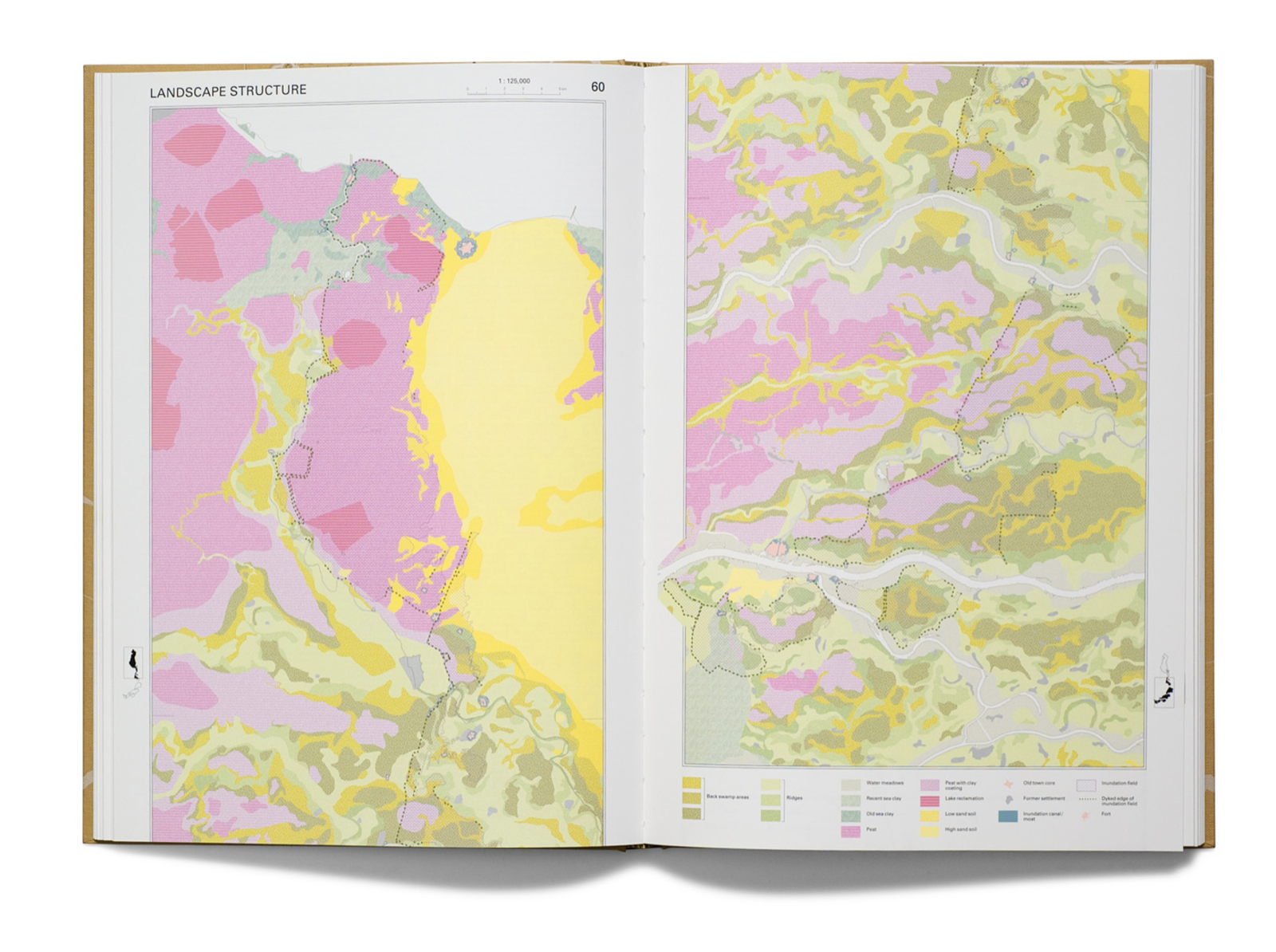 Open atlas spread titled Landscape Structure: two facing maps of Dutch soils in pinks, yellows and olive greens, with a legend of color swatches along the bottom. On the right-hand map, a grey river runs out past the map&rsquo;s frame.